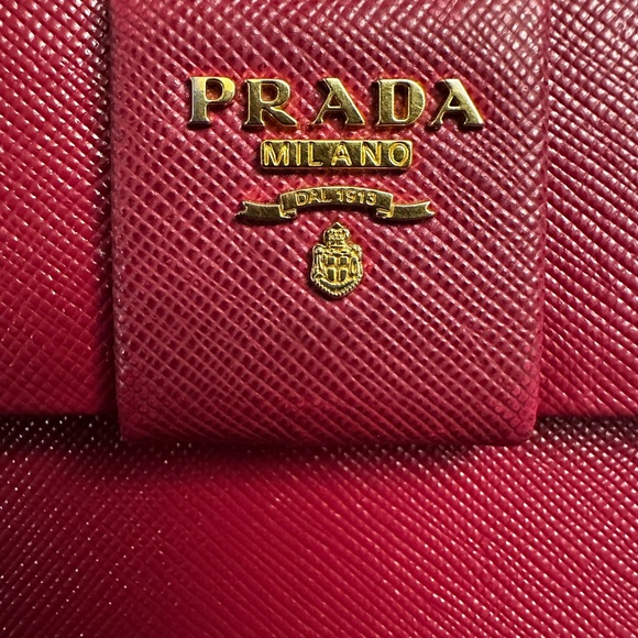 Authentic Prada Elegant Bow Wallet in dark pink/purple color. - Picture 11 of 16